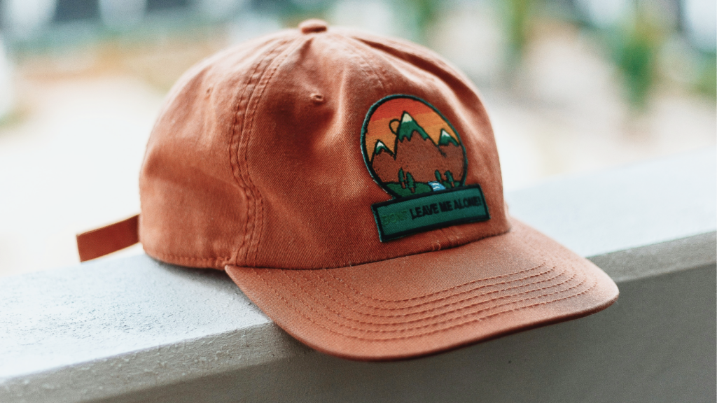 A hat with an iron-on patch on it.