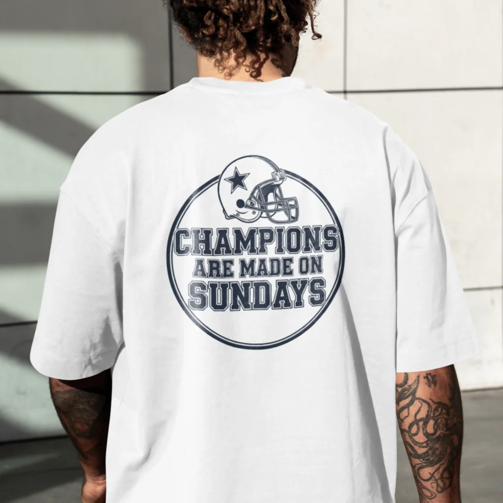 08 Champions are made on Sundays A man wearing a white t-shirt with a football helmet and the text "Champions are made on Sundays" printed on the back.