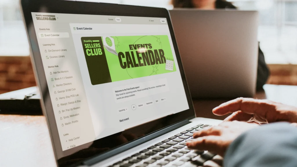 Hands above a laptop keyboard, with Printify’s Sellers Club homepage on the screen.