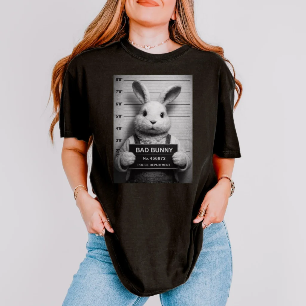 Woman wearing a black t-shirt with a humorous "Bad Bunny" mugshot design.
