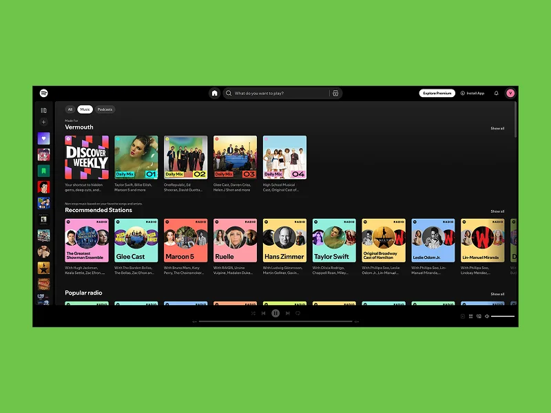 A music streaming app interface on a green background showcasing playlists like Discover Weekly, Daily Mix, and Recommended Stations, with vibrant album art.