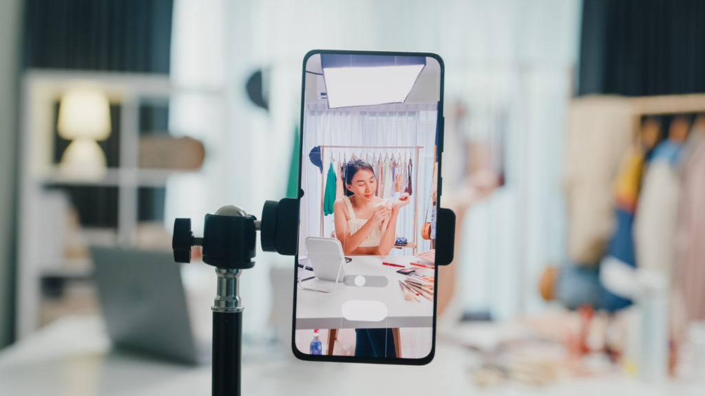 1 Breaking down your total POD production costs Person is filming a video on the phone
