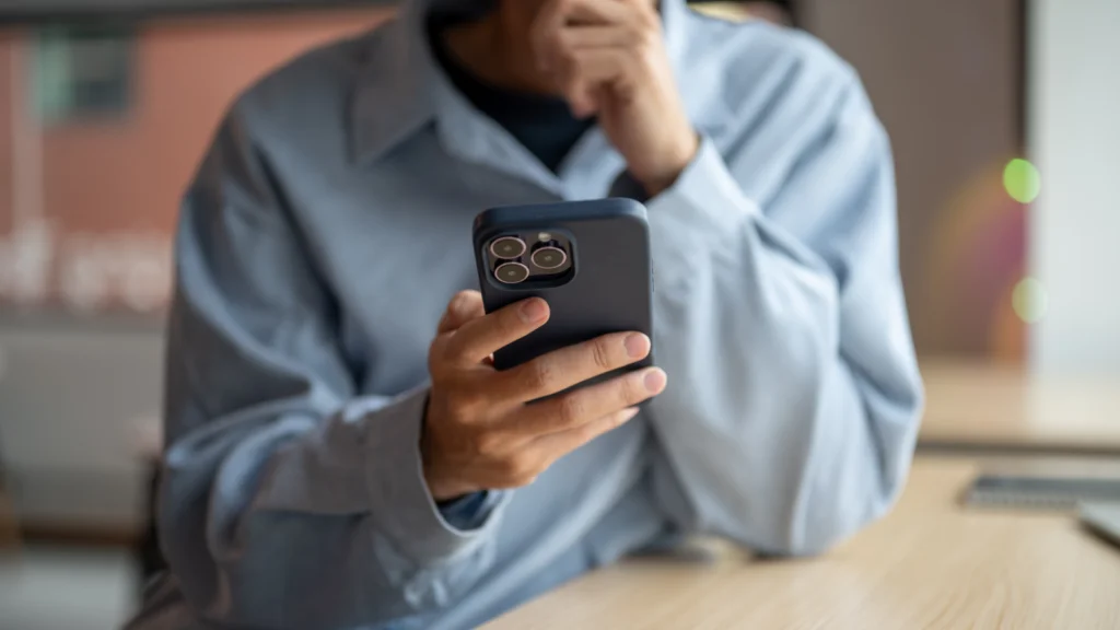 How TikTok affiliate marketing actually works A person is holding a smartphone in their hand.