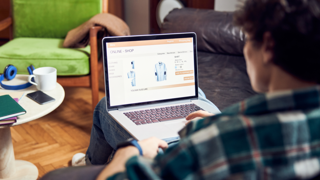01 What this means for your customers A backshot of a man sitting in a chair with a laptop and shopping online for shirts.