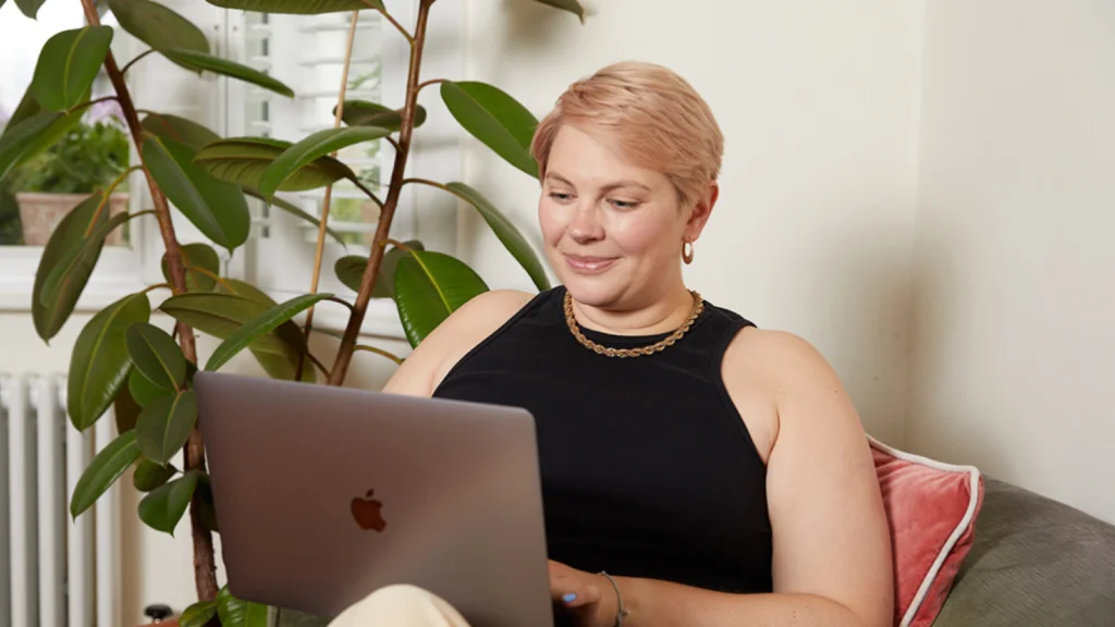A woman working on a computer.
