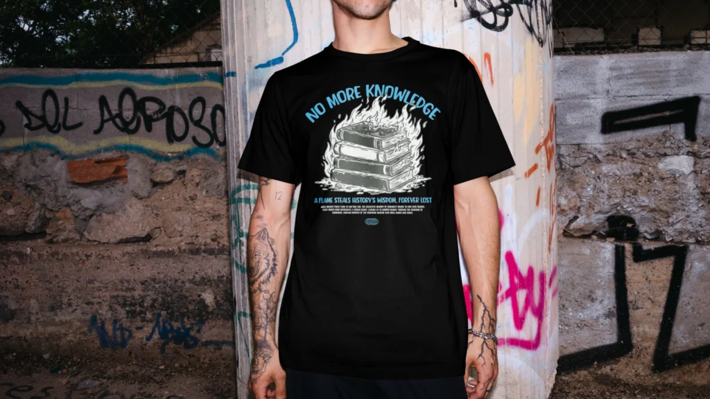 01 Custom t shirts A man wearing a black t-shirt with the text "NO MORE KNOWLEDGE" and a graphic design of a stack of books on fire.