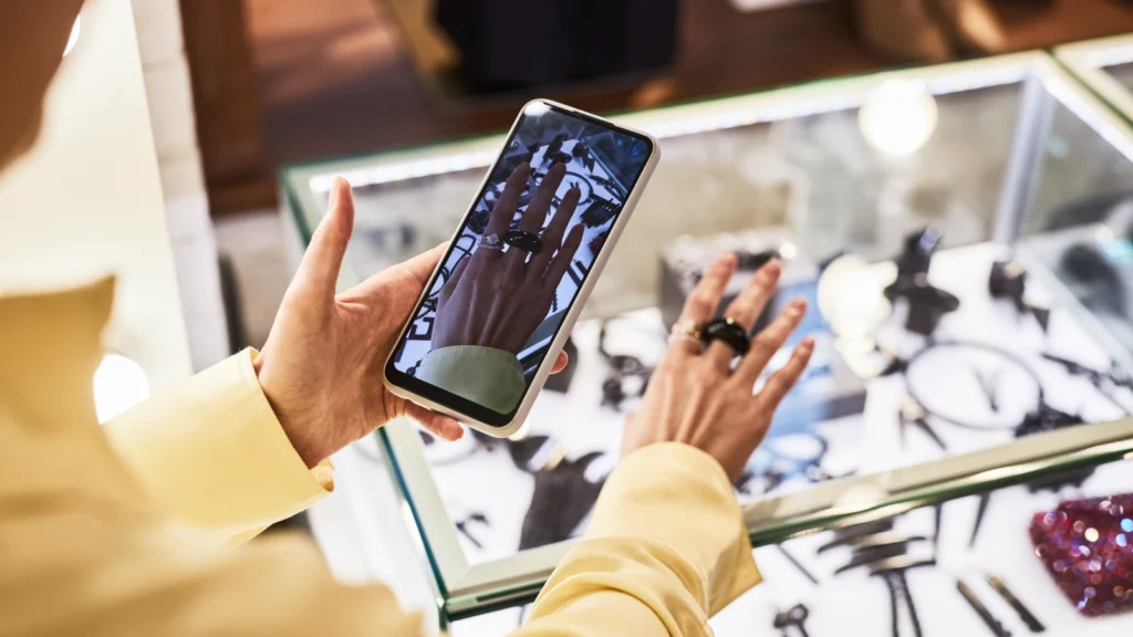Common Etsy thumbnail mistakes to avoid A woman is taking a picture of a ring on her hand using a smartphone.