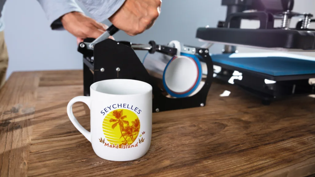 Dye sublimation printing A person is using a printer next to a mug with "Seychelles Makani Island" printed on it.