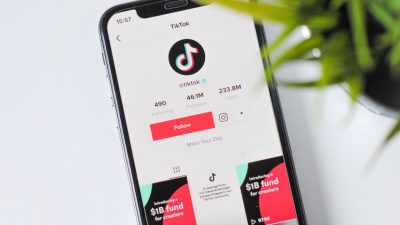 A photo of the TikTok official profile app open on a smartphone.